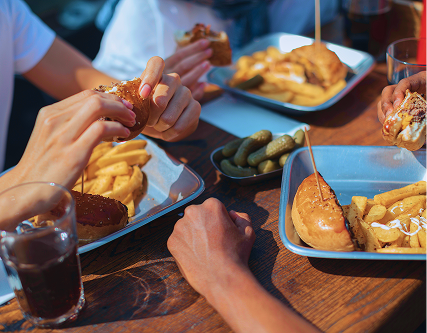 People eating burgers in NoDa Charlotte, NC
